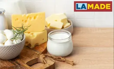 soft cheeses displayed on a wood table