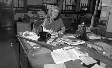 Agness "Aggie" Underwood at her desk in 1949