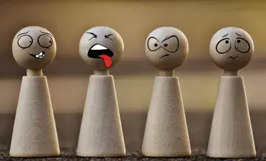 A group of game pieces with faces.