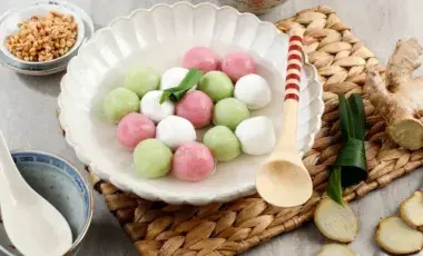 colorful chinese dessert dumplings with ingredients and utensils