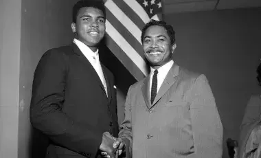 Mervyn Dymally (right) meets Muhammad Ali (left) at a Compton NAACP meeting in 1966.