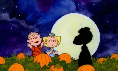 Charlie brown characters search for the great pumpkin in a pumpkin patch