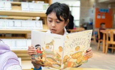 kid reading book