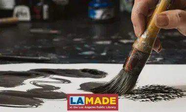 hand painting ink with a brush