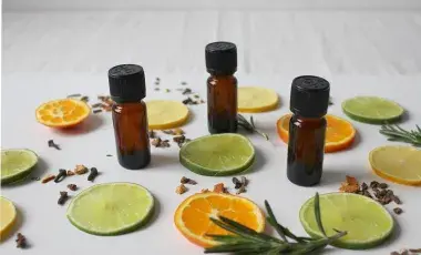 Array of beauty vials interspersed with orange and lemon slices