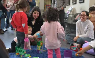 kids palying with blocks in the library