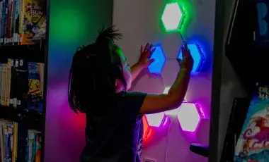 young child plays with sensory light