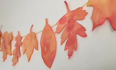 tie dyed coffee filter leaves on a garland
