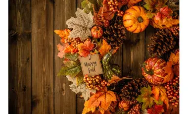 Fall wreath with leaves and pumpkins