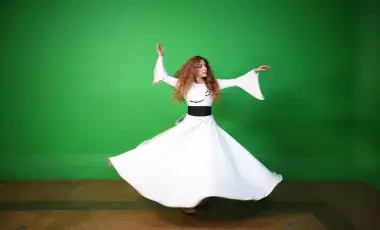 Person in motion doing the Whirling Dance.