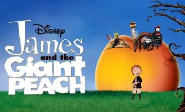 James in front of a giant peach