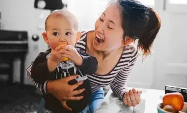 Woman holding a baby