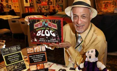 Manny Pacheco with his books