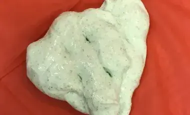 Green slime on a red tablecloth