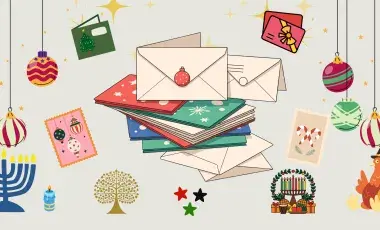 Holiday cards surrounded by holiday graphics 