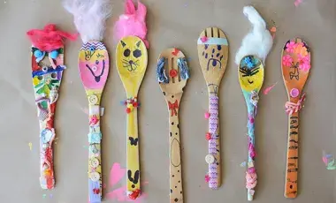 colorfully decorated wooden spoon puppets