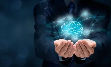 hands holding a brain representing intellectual property