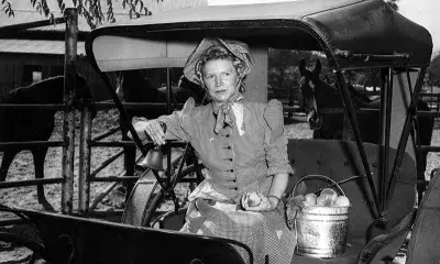 Valley historian and pioneer Frances Muir Pomeroy with the first bell used at North Hollywood High School