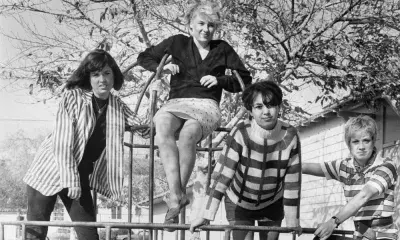 Members from “The Bangles," 1983 pose on a playground structure