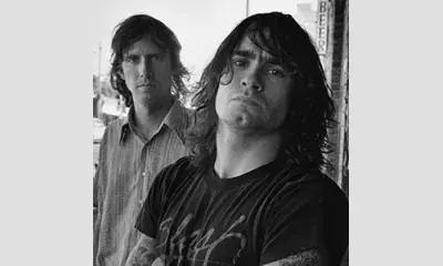 Greg Ginn and Henry Rollins from band, “Black Flag , ”1984