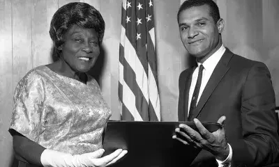 Madame AC Bilbrew receives a resolution from Councilman Billy Mills in 1956.