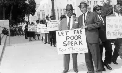 Leon Washington protests the election of the board to oversee Anti-Poverty funds in front of City Hall in 1965.