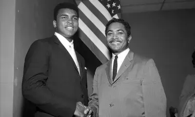 Mervyn Dymally (right) meets Muhammad Ali (left) at a Compton NAACP meeting in 1966.