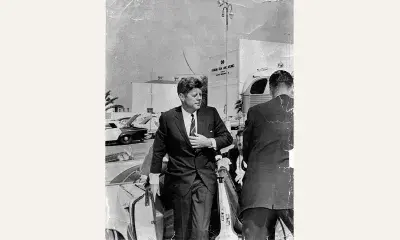 John F. Kennedy exiting car