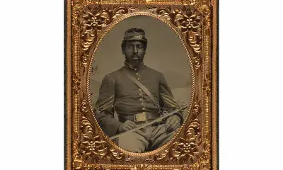 Ninth-Plate Hand Tinted Ambrotype taken between 1863 – 1865. This image shows an African American Union cavalry sergeant are with a saber.