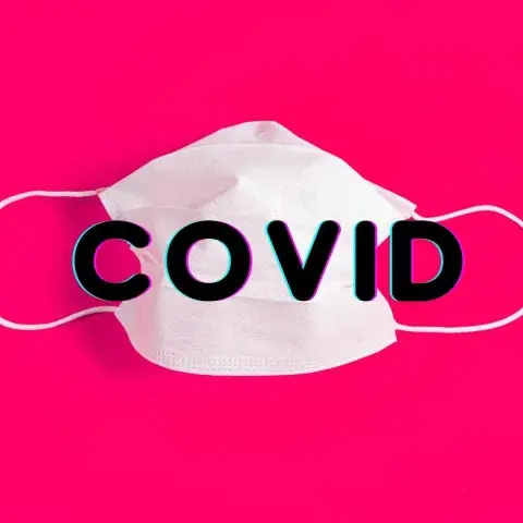 A surgical mask reminds us of the challenges of COVID.