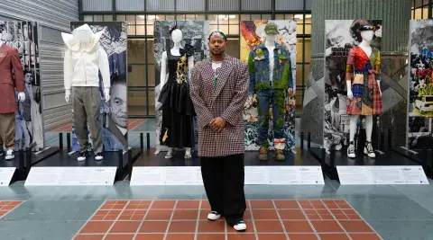 Ashley Walker poses in front of exhibit.