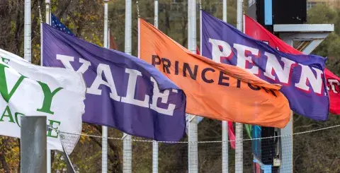 Flags of the Ivy League Universities fly over Columbia's Wien Stadium
