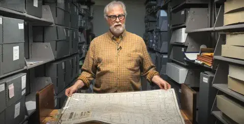 Glen Creason holding map