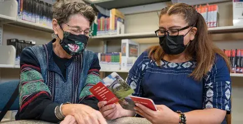 Tutor helps adult learner study for her US Citizenship