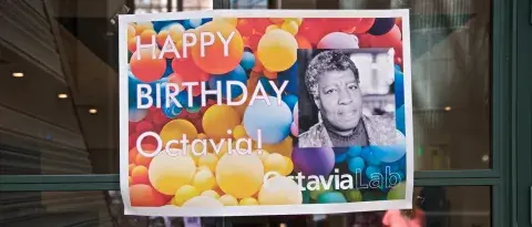 Octavia E. Butler birthday sign on the door of the Octavia Lab