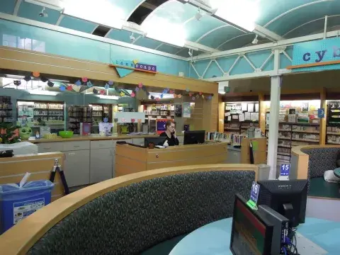 Senior Librarian Mary McCoy at the Teen'Scape Desk 