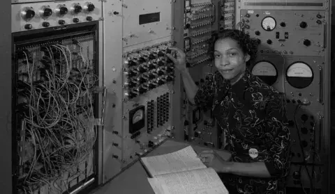 woman in front of phone operator board