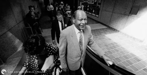 Tom Bradley on an escalator at the opening of the Red Line subway downtown, 1-30-93.