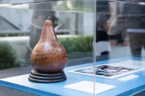 gourd with Korean text painted on it.