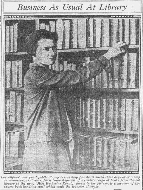 Katharine Kendig reaches for a library book