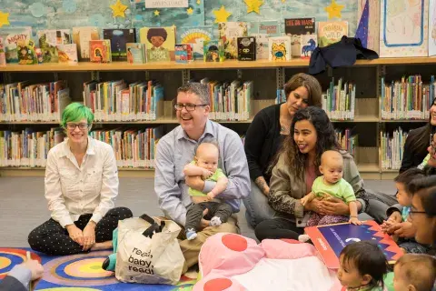 adults and babies at a library storytime