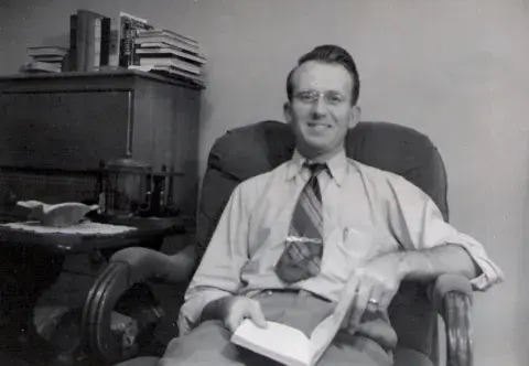 Man reading a book 1950