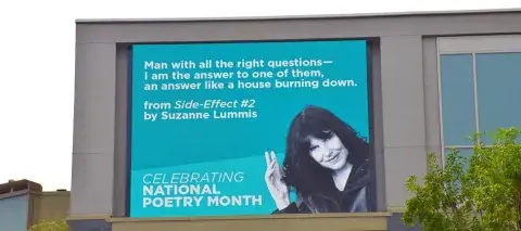 Billboard of Suzanne Lummis for "Celebrating National Poetry Month."