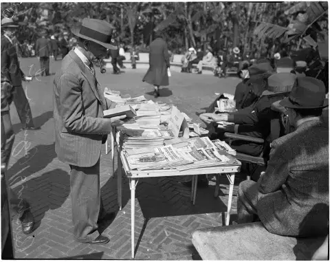 Man perusing magazines, 1937
