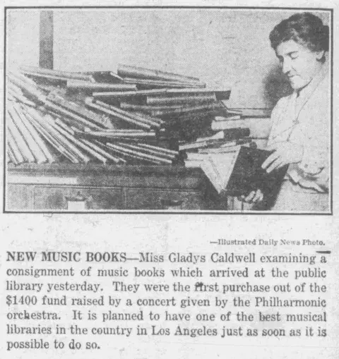 Gladys Caldwell looking at score books