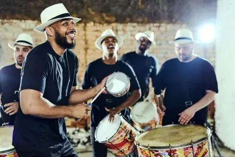A group of Latin musicians playing traditional  musical instruments.