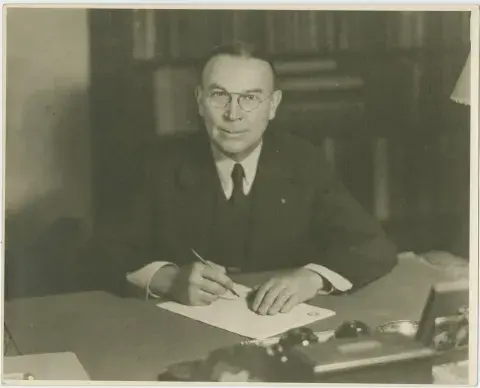 Carleton Monroe Winslow Sr. pen in hand