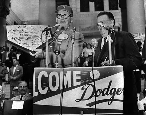 president of the Dodgers presenting home plate to mayor