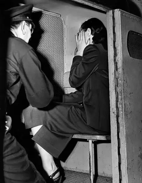 August 11, 1948 With her hand up, apparently to hide an ironically 