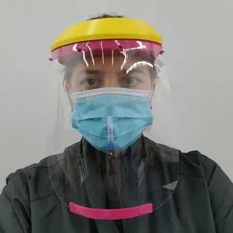 staff member wearing a full face shield